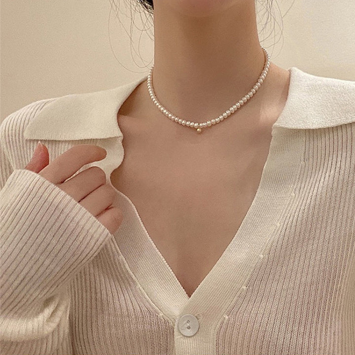 Delicate pearl necklace with elegant gold accent chain Stornfield