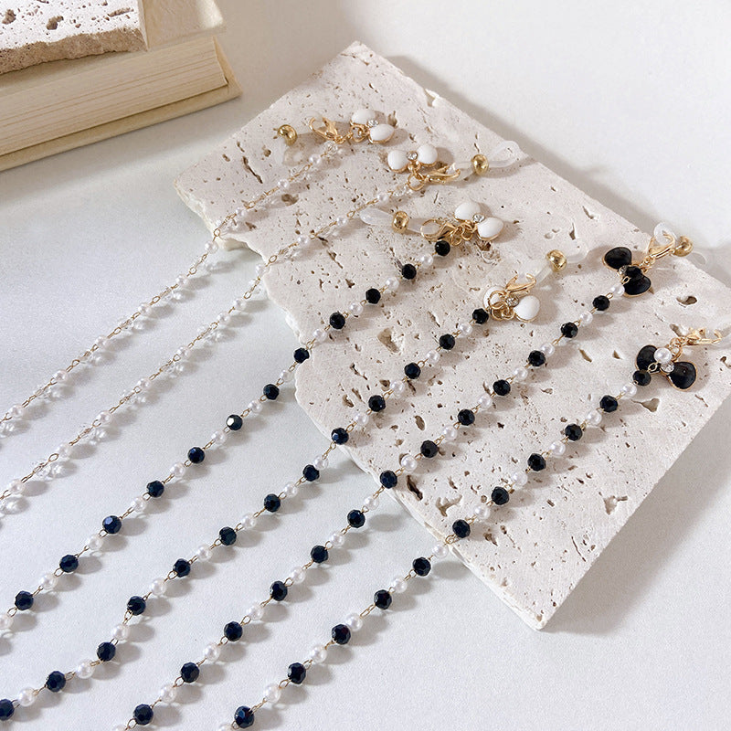 Elegant earrings with pearls and flower pendants Stornfield