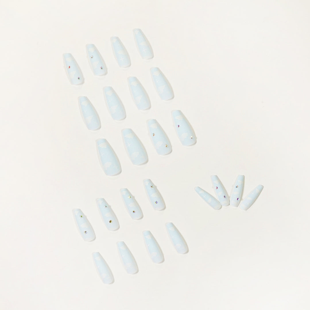 Creative nail art in cloud design with glitter accents Stornfield