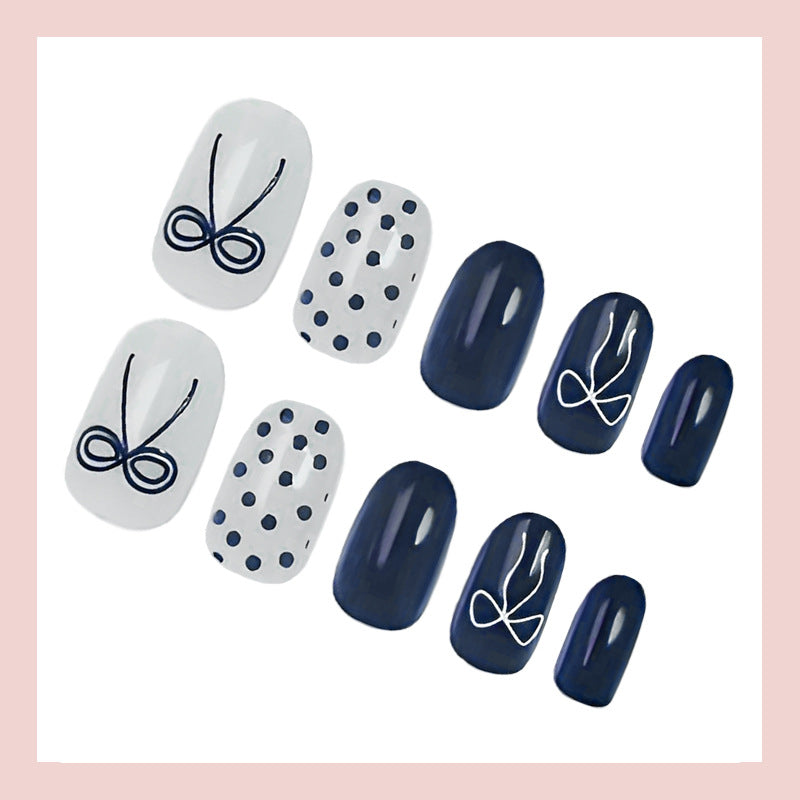 Nail set with stylish bows and dots Stornfield