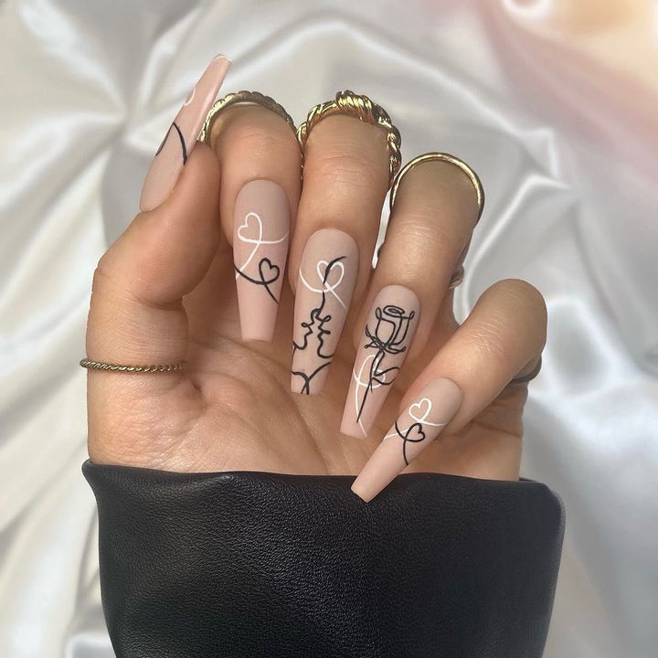 Artful nail extensions with creative line and heart design Stornfield