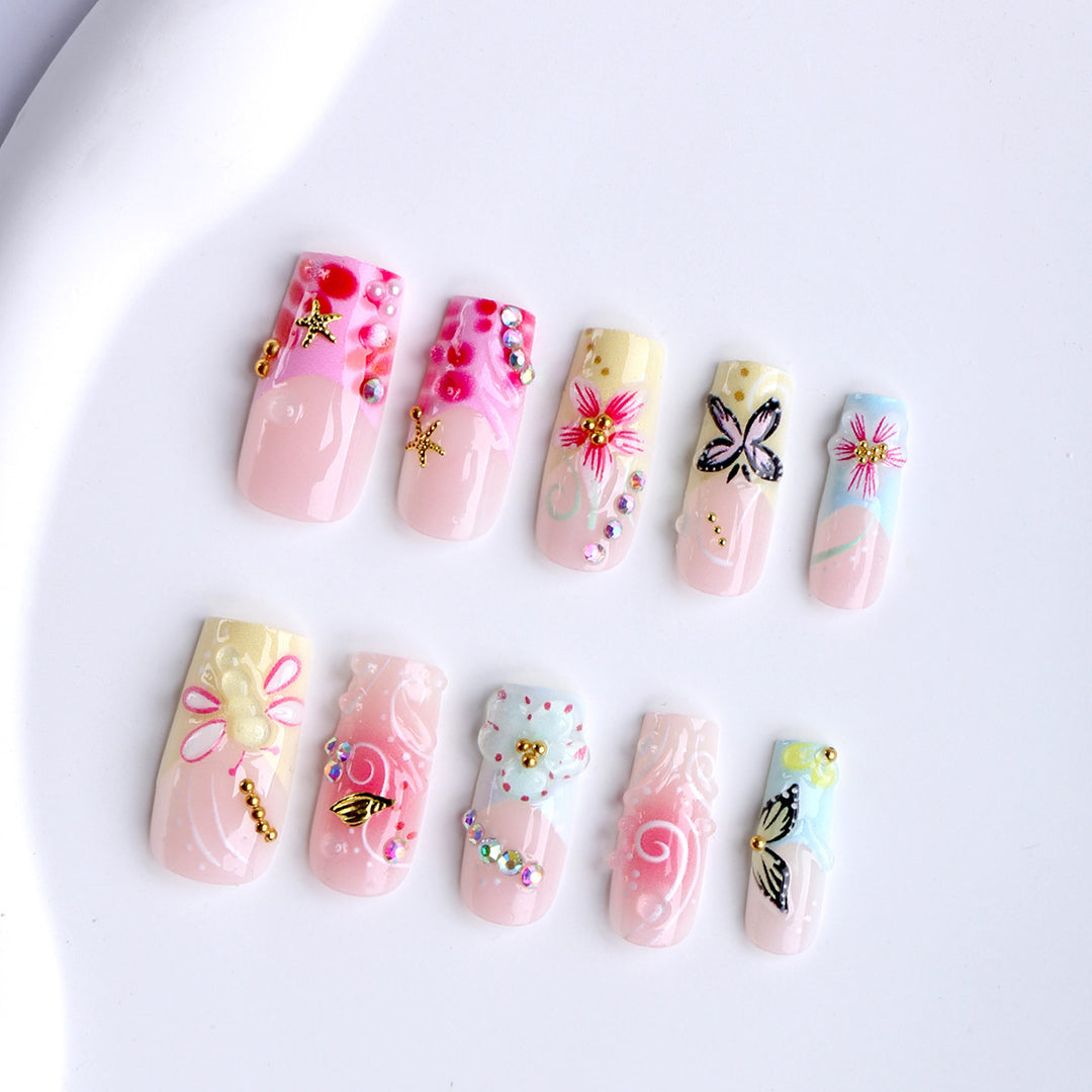 Artistic nails with floral accents and glitter clusters Stornfield