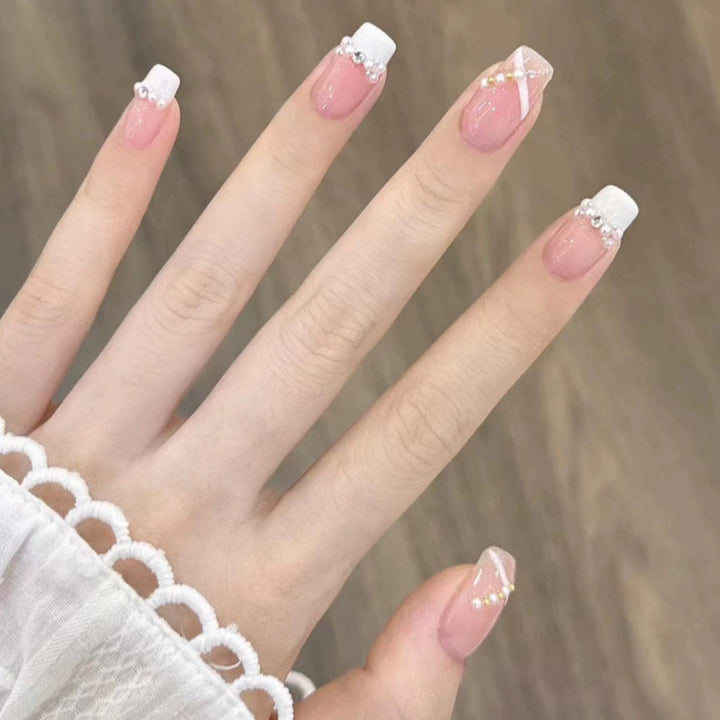 Elegant nail design with pearl embellishment Stornfield