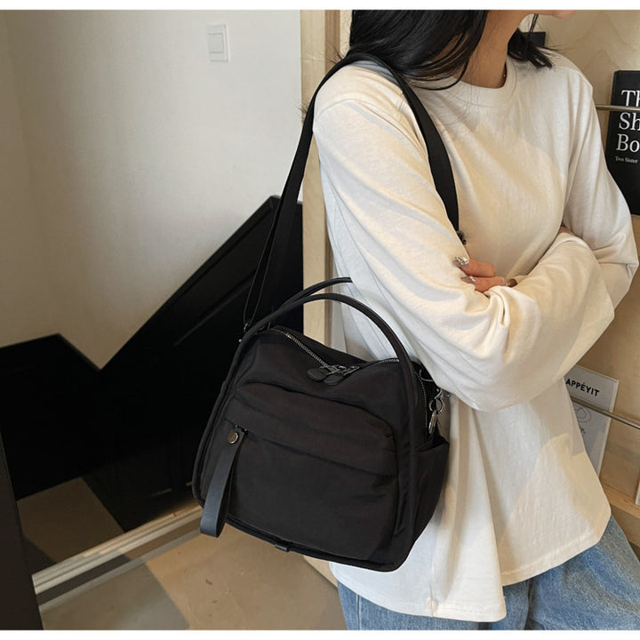 Fashionable shoulder bag with innovative structure and detachable carrying strap Stornfield