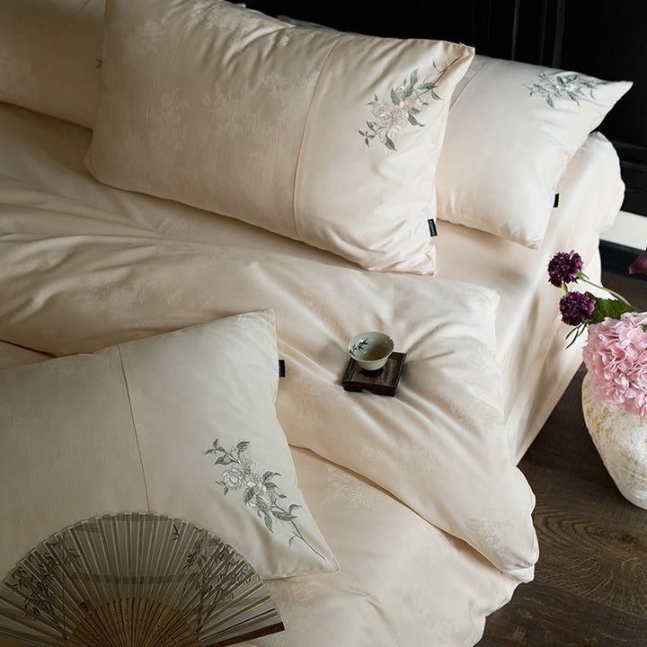 Luxurious satin bedding set with delicate floral embroidery