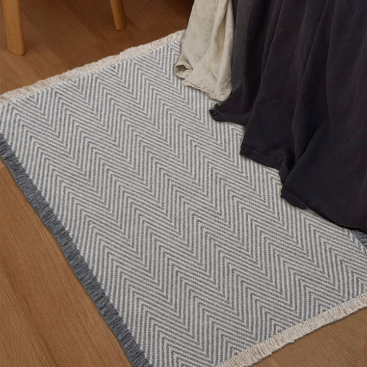 Handwoven cotton bath mat with herringbone pattern and fringes Stornfield