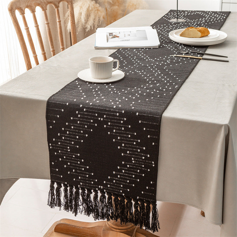 Handwoven table runner made of cotton blend with fringes and geometric dot jacquard Stornfield