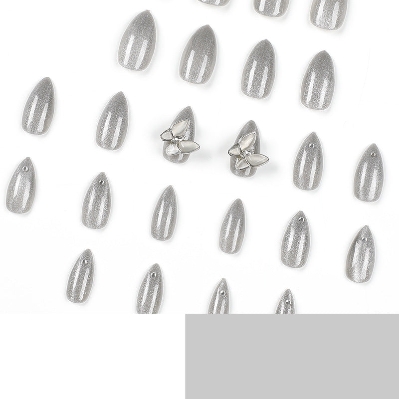 Glamorous stiletto nails with radiant glitter and elegant 3D design Stornfield