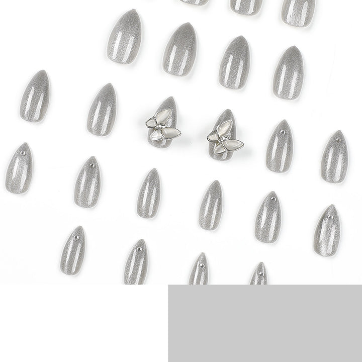 Glamorous stiletto nails with radiant glitter and elegant 3D design Stornfield