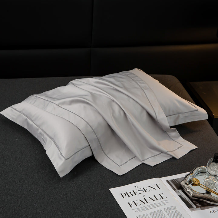 Luxurious satin cushion cover with decorative double piping
