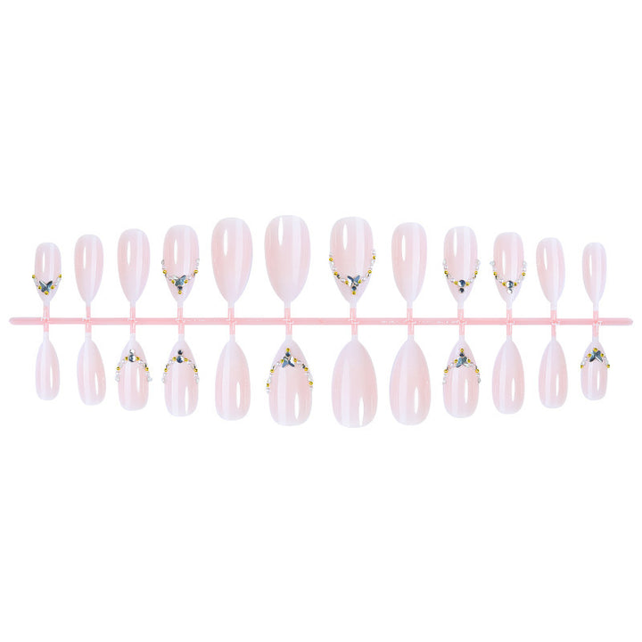 Acrylic nail set with elegant rhinestone decorations and glamorous designs Stornfield
