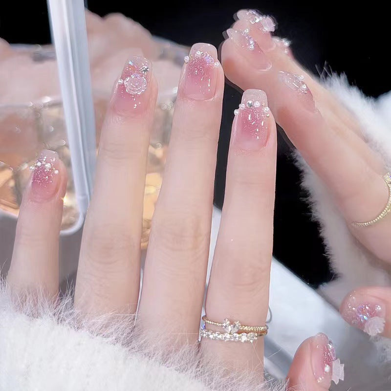 Glamorous nail art with rhinestone and pearl accents Stornfield