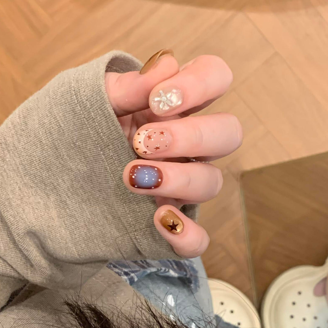 Artificial nails in modern design with star and gradient elements Stornfield