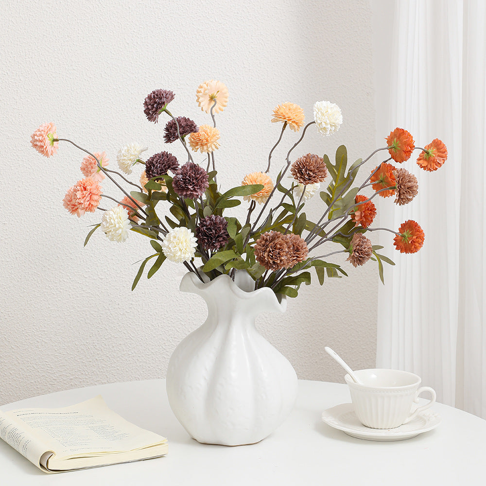 Artificial flower branch with intricate flowers