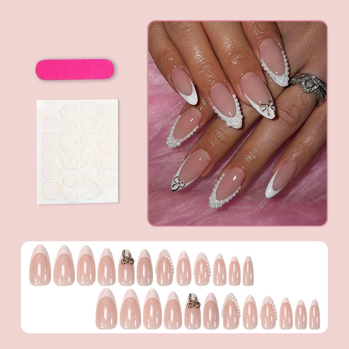 Glamorous artificial nail set with elegant bows and glitter accents Stornfield