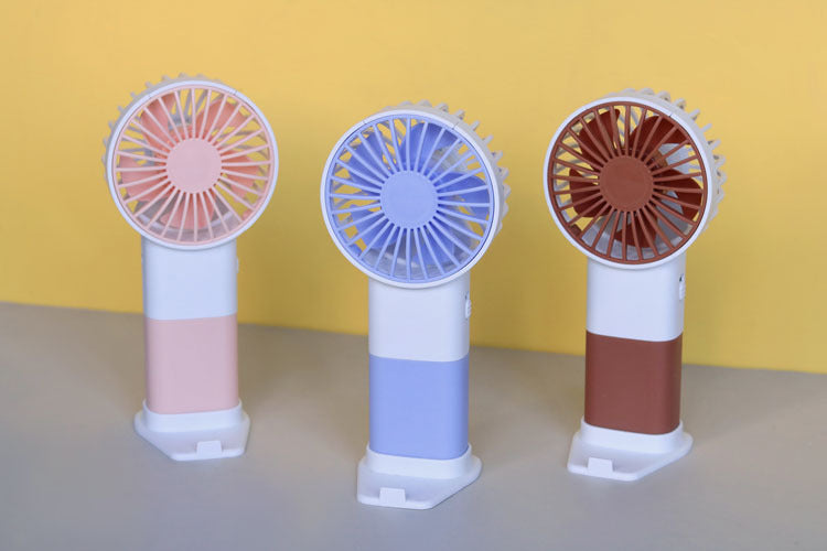 Unisex handheld fan with ergonomic design and USB charging function Stornfield
