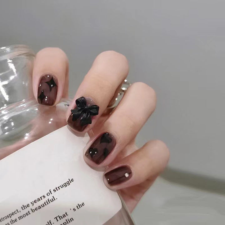 Artificial nails with elegant ribbon and heart designs Stornfield