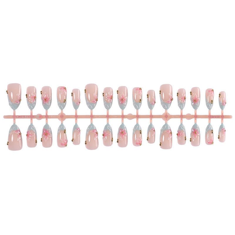 Creative nail art set with delicate flower design and glitter accents Stornfield