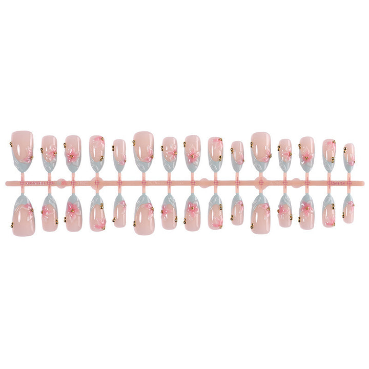 Creative nail art set with delicate flower design and glitter accents Stornfield