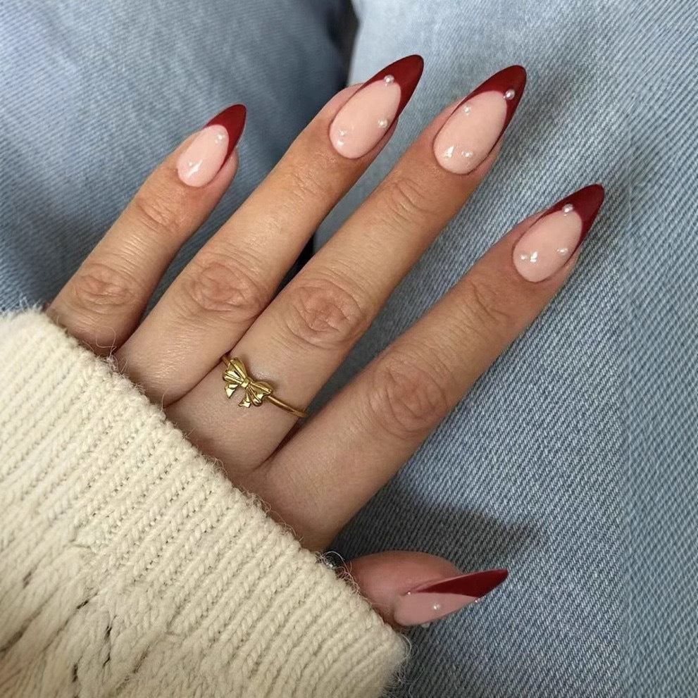 Acrylic nail set with elegant spike design and shimmering accents Stornfield
