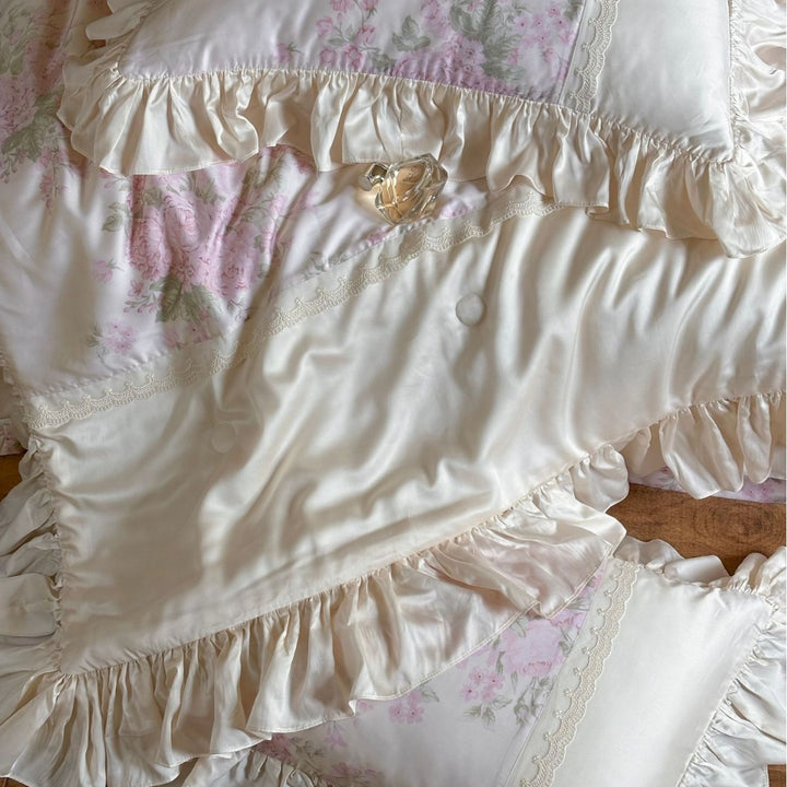Ruffled satin pillowcase with flounce, lace border, and floral insert