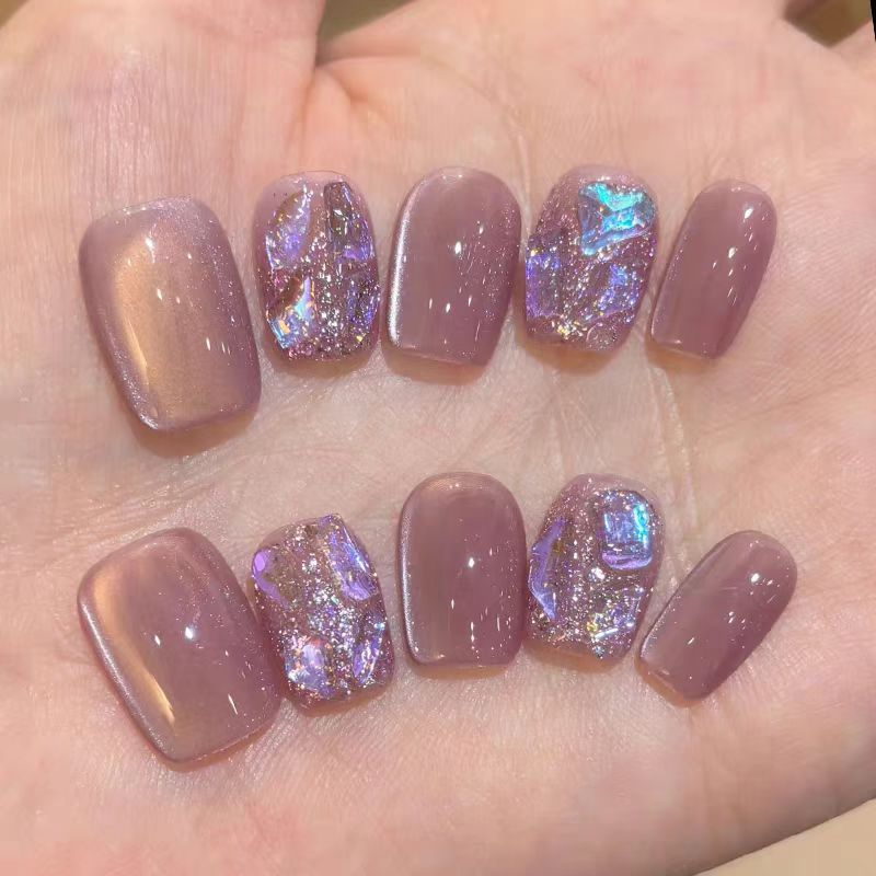 Acrylic nails with glitter accents and modern designs Stornfield