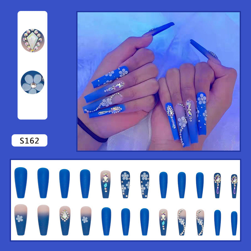 Nail art set with elegant 3D flower designs and glitter accents Stornfield