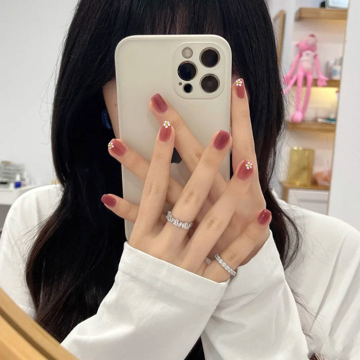 Elegant artificial nails with floral designs Stornfield