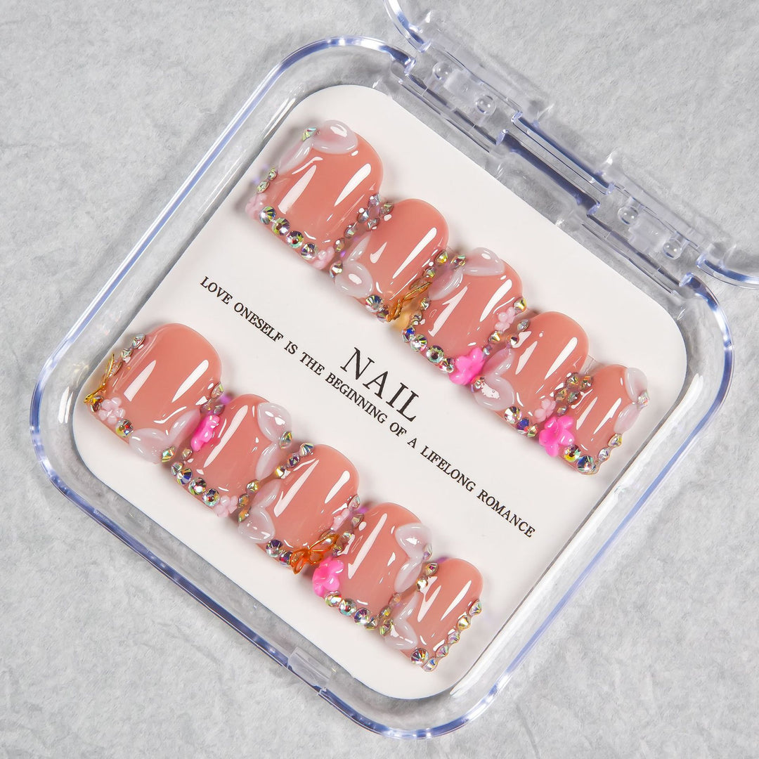 Decorative Press-On Nail Set with Soft Pink Accents and Gem Details