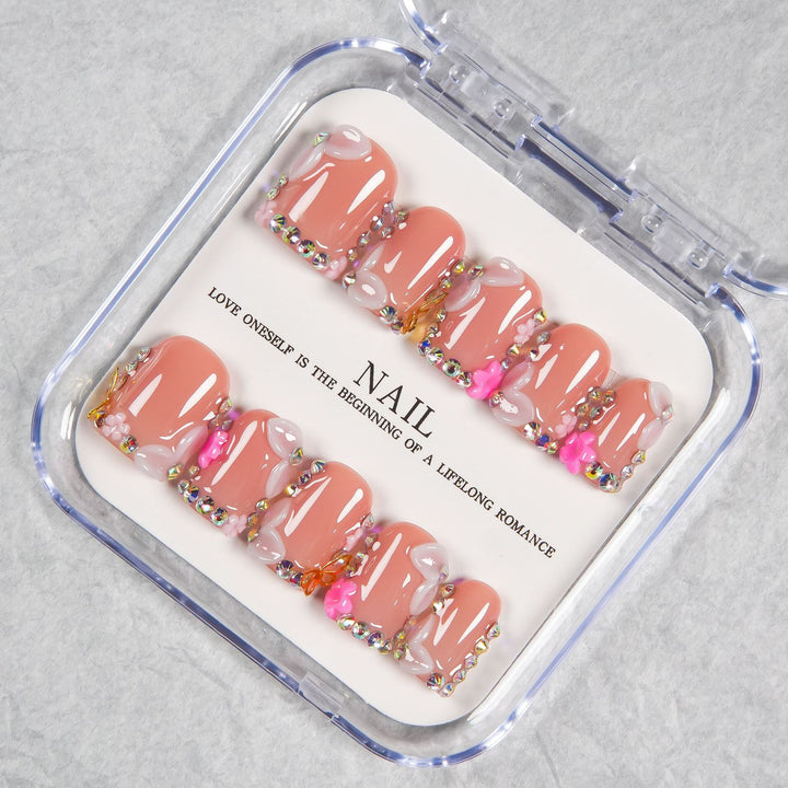 Decorative Press-On Nail Set with Soft Pink Accents and Gem Details