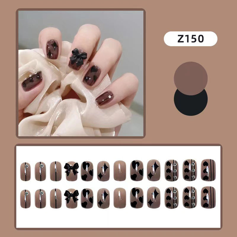 Artificial nails with elegant ribbon and heart designs Stornfield