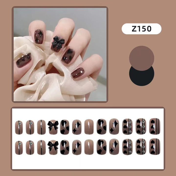 Artificial nails with elegant ribbon and heart designs Stornfield