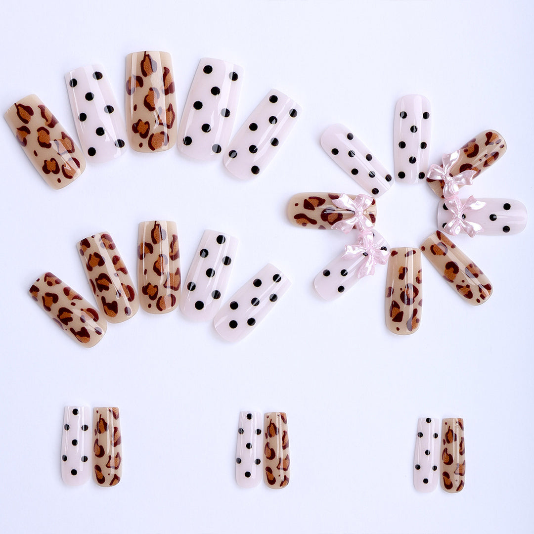 Creative artificial nails with bows and dots Stornfield