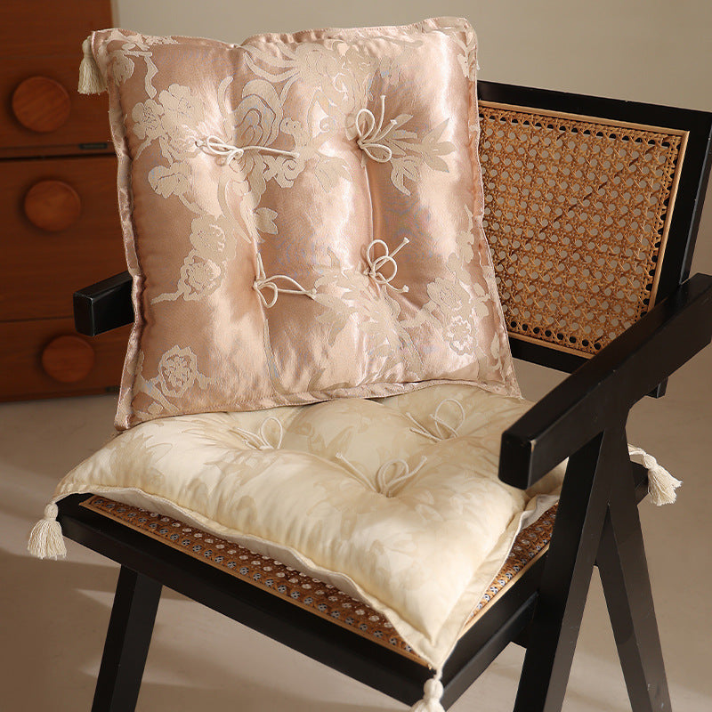 Padded floor cushion with quilted tufting and tassels