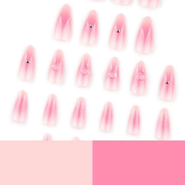 Artful stiletto nails with heart design and glitter accents Stornfield