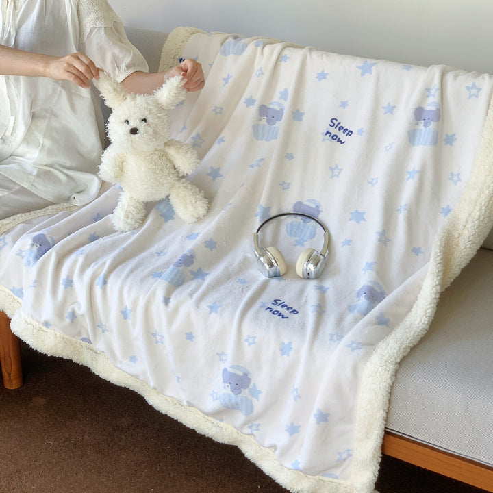 Reversible fleece blanket with cartoon cat design and teddy lining