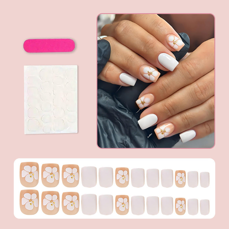 Artificial nail set with luxurious flower design and subtle gold accents Stornfield