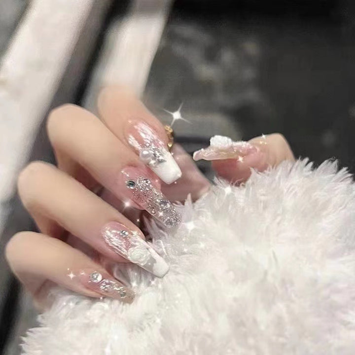 Elegant artificial nails with glitter and flower decoration Stornfield