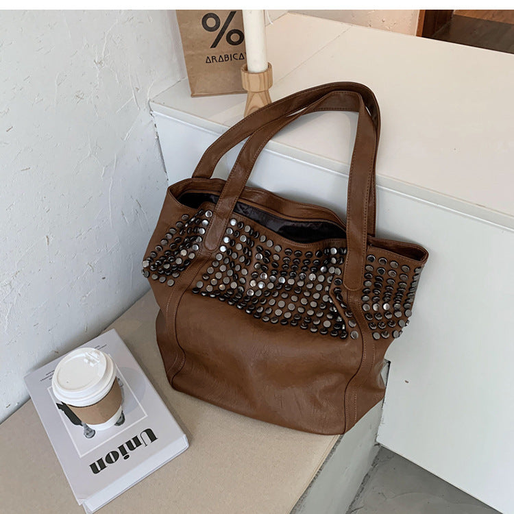 Fashionable shoulder bag with stylish rivet details Stornfield