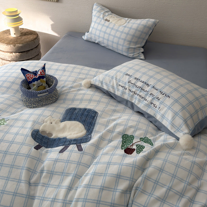 Plush bedding set with embroidered dog motif and striped cuddle blanket