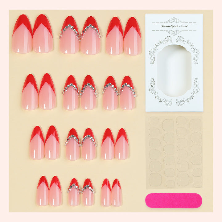 Nail art set with elegant red accents and rhinestone embellishments Stornfield