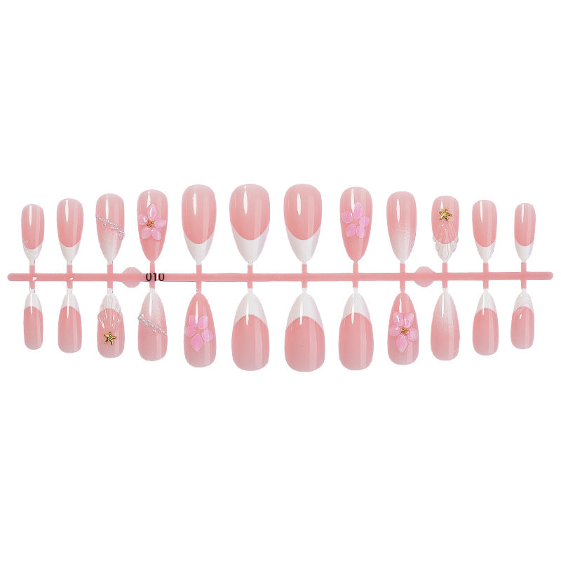 Artifical nail set with delicate flower and decorative elements Stornfield