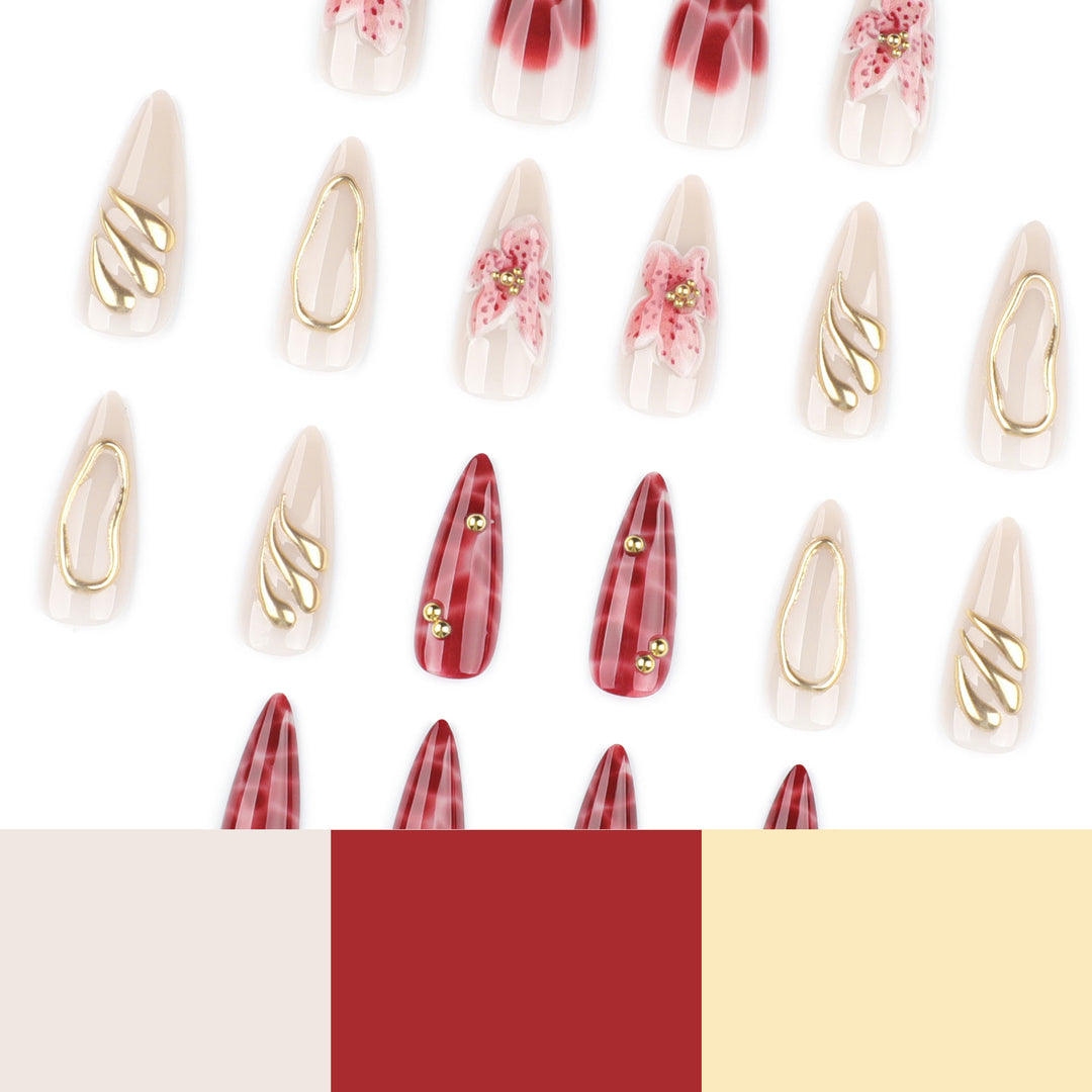Artful stiletto nails with elegant floral designs and glitter accents Stornfield