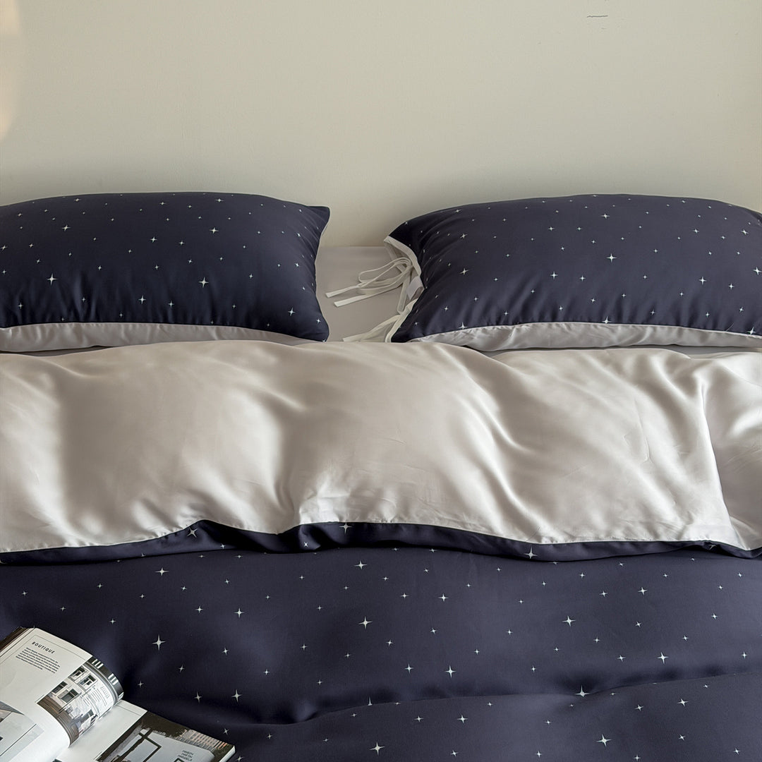 Bedding set with fine star pattern and pillow tie ribbons