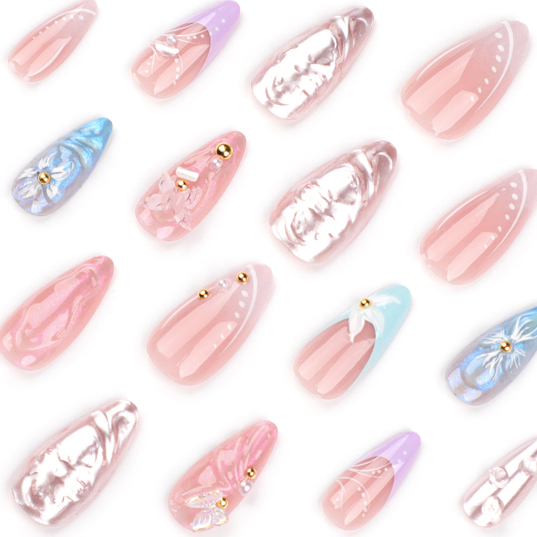 Artistic stiletto nails with delicate flower and glitter embellishments Stornfield