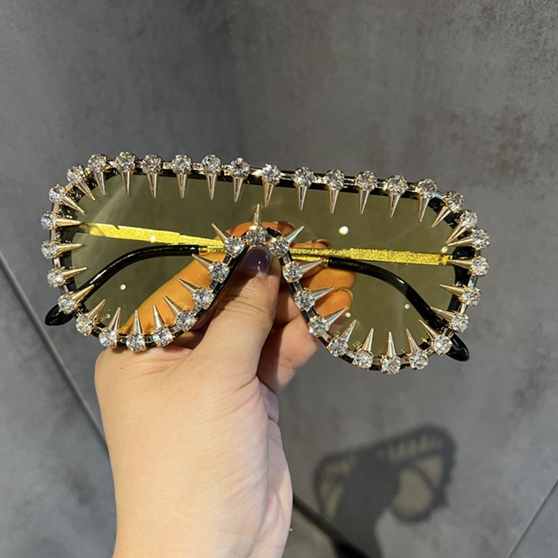 Ladies extravagantly designed cat-eye sunglasses with glitter accents Stornfield