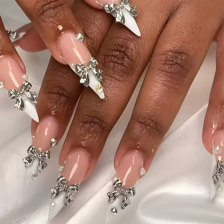 Acrylic nail set with elegant bows and sparkling accents Stornfield