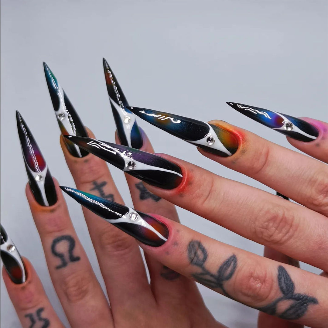 Artful stiletto nails with sparkling accents and geometric design Stornfield