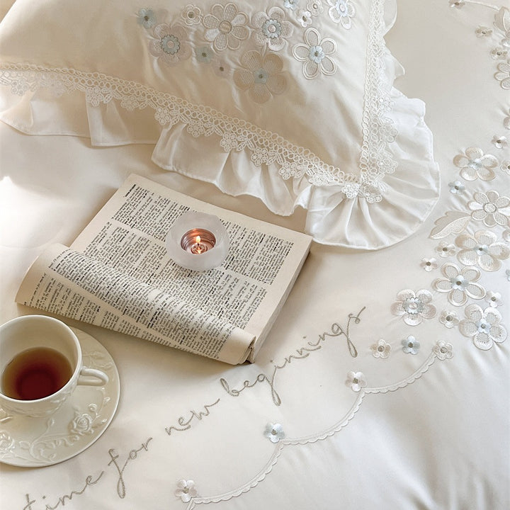 Victorian-inspired cotton satin bedding set with lace ruffles and bows