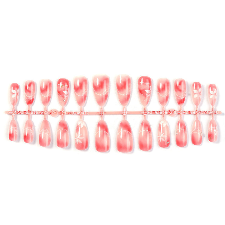 Acrylic nail set with elegant ombre design and floral accent Stornfield